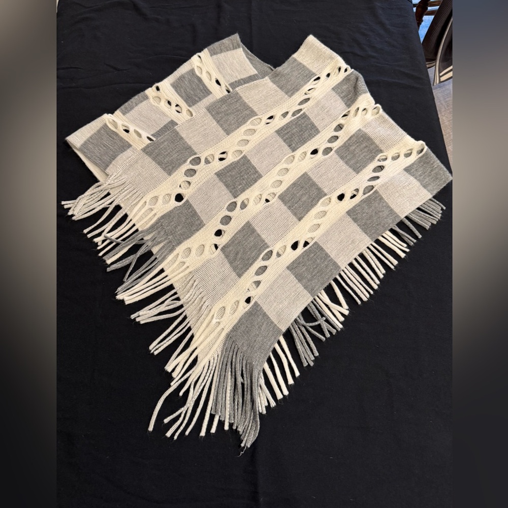 Grey and white fringed shrug.